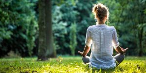 woman meditating in nature